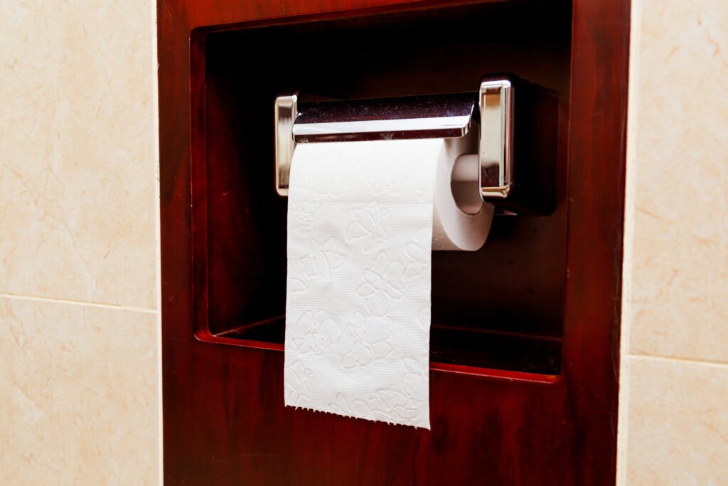 Bathroom Hardware Ideas: Perfecting Your Bathroom Aesthetic roll of toilet paper on a brass fixture 2023 11 27 05 34 15 utc